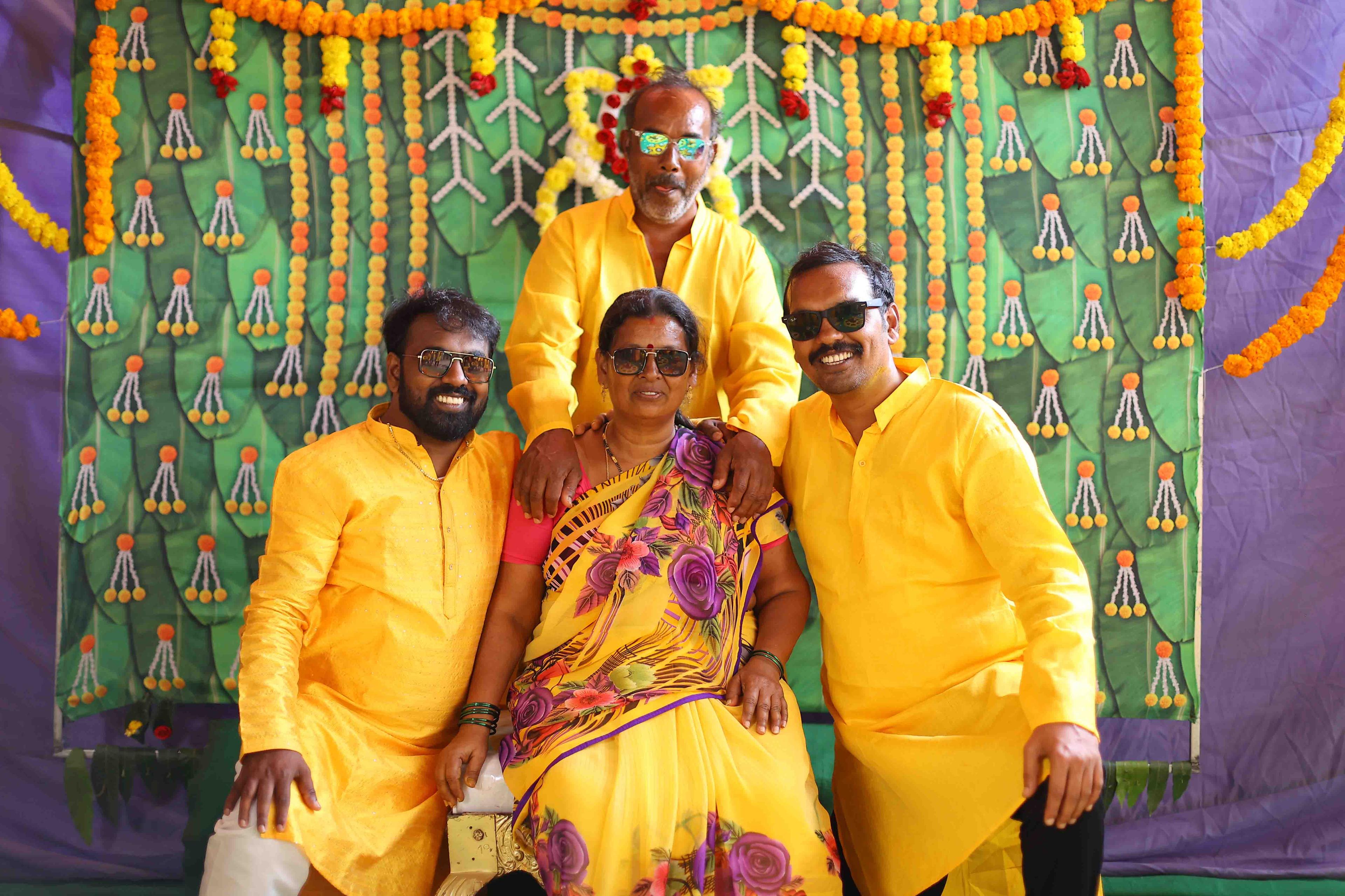 Anil posing happily with his loving family during the ceremony
