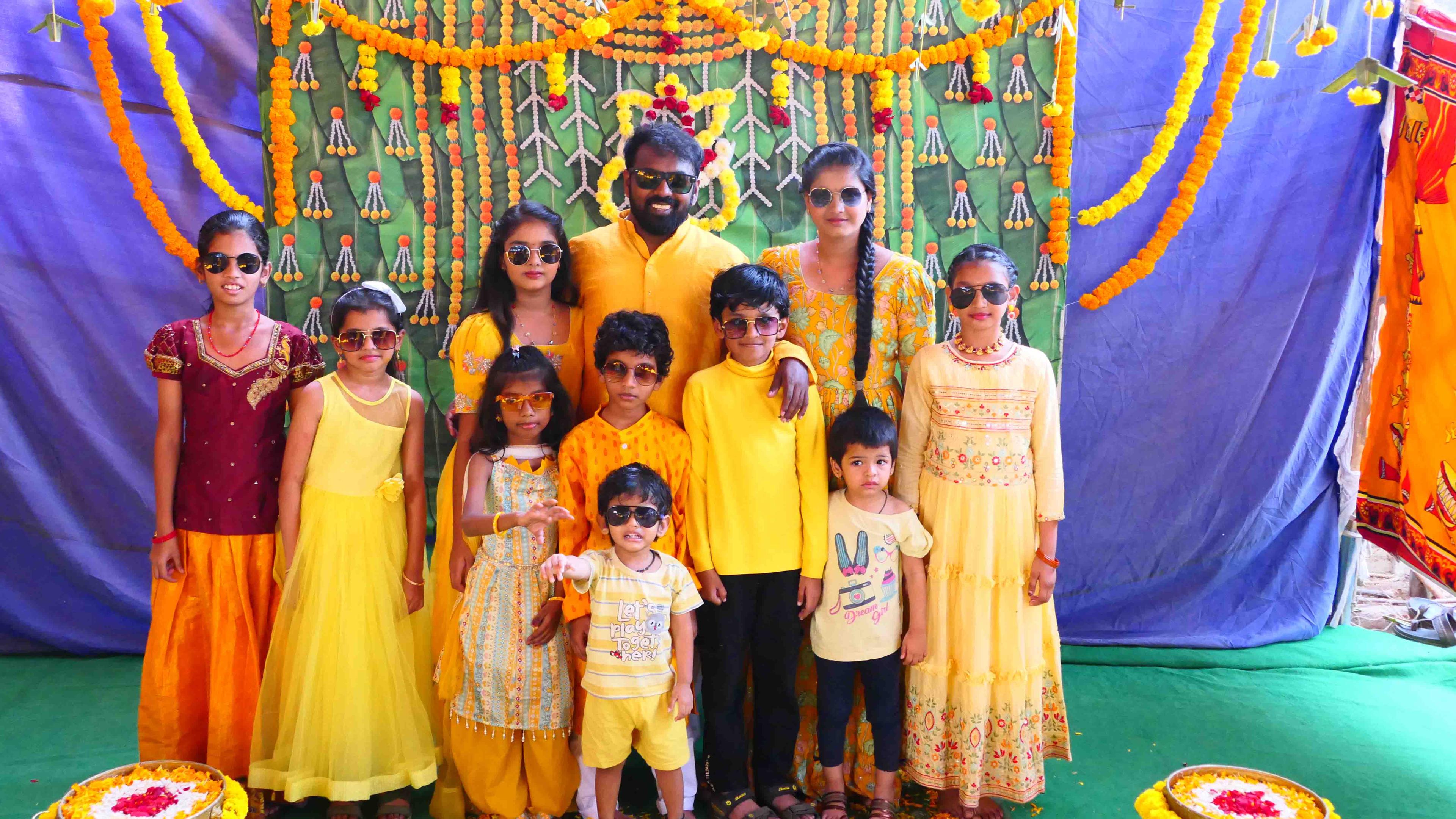 Anil having a playful and sweet moment with the children