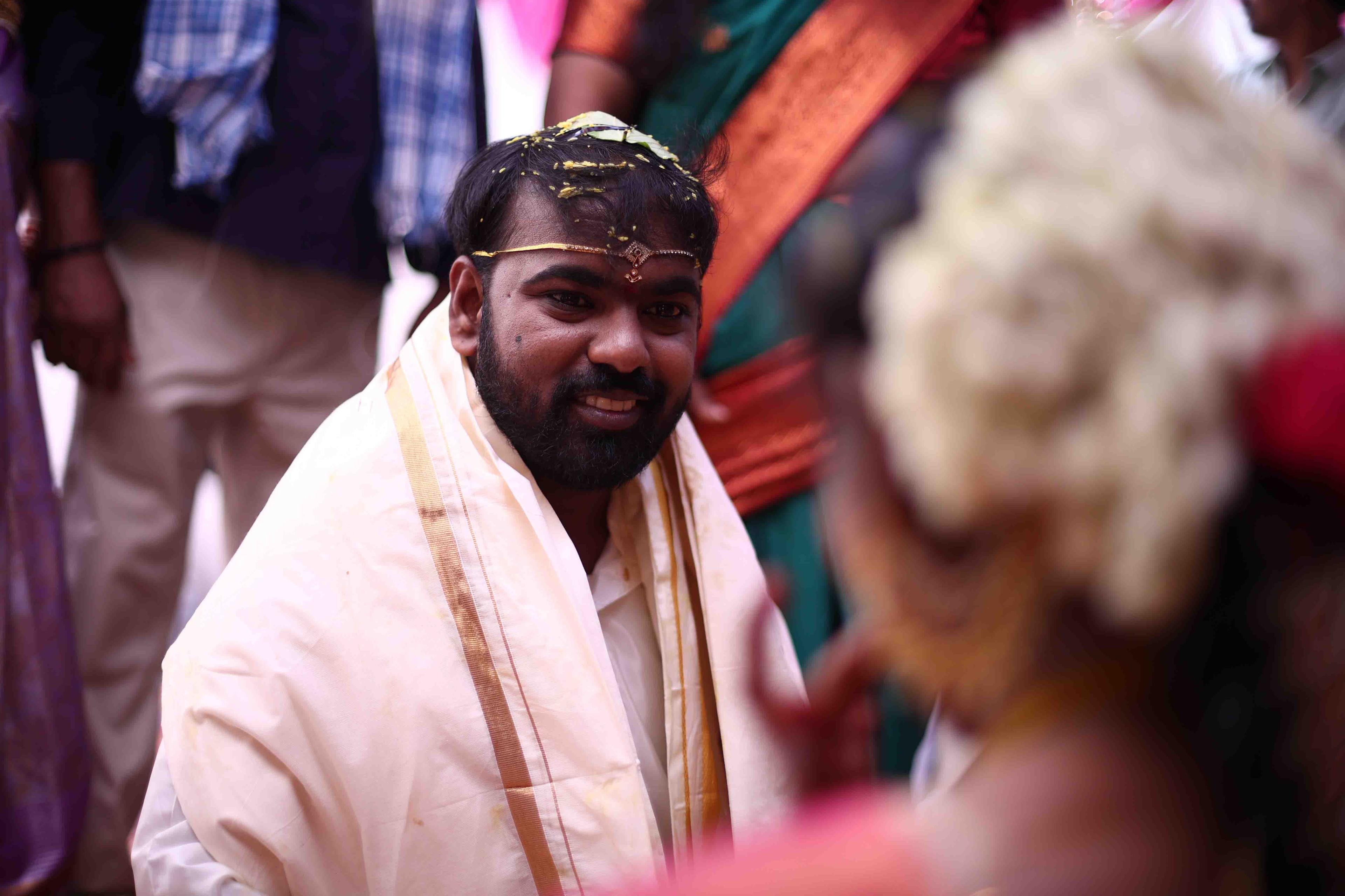Anil looking warmly toward Eswari during the sacred wedding ceremony