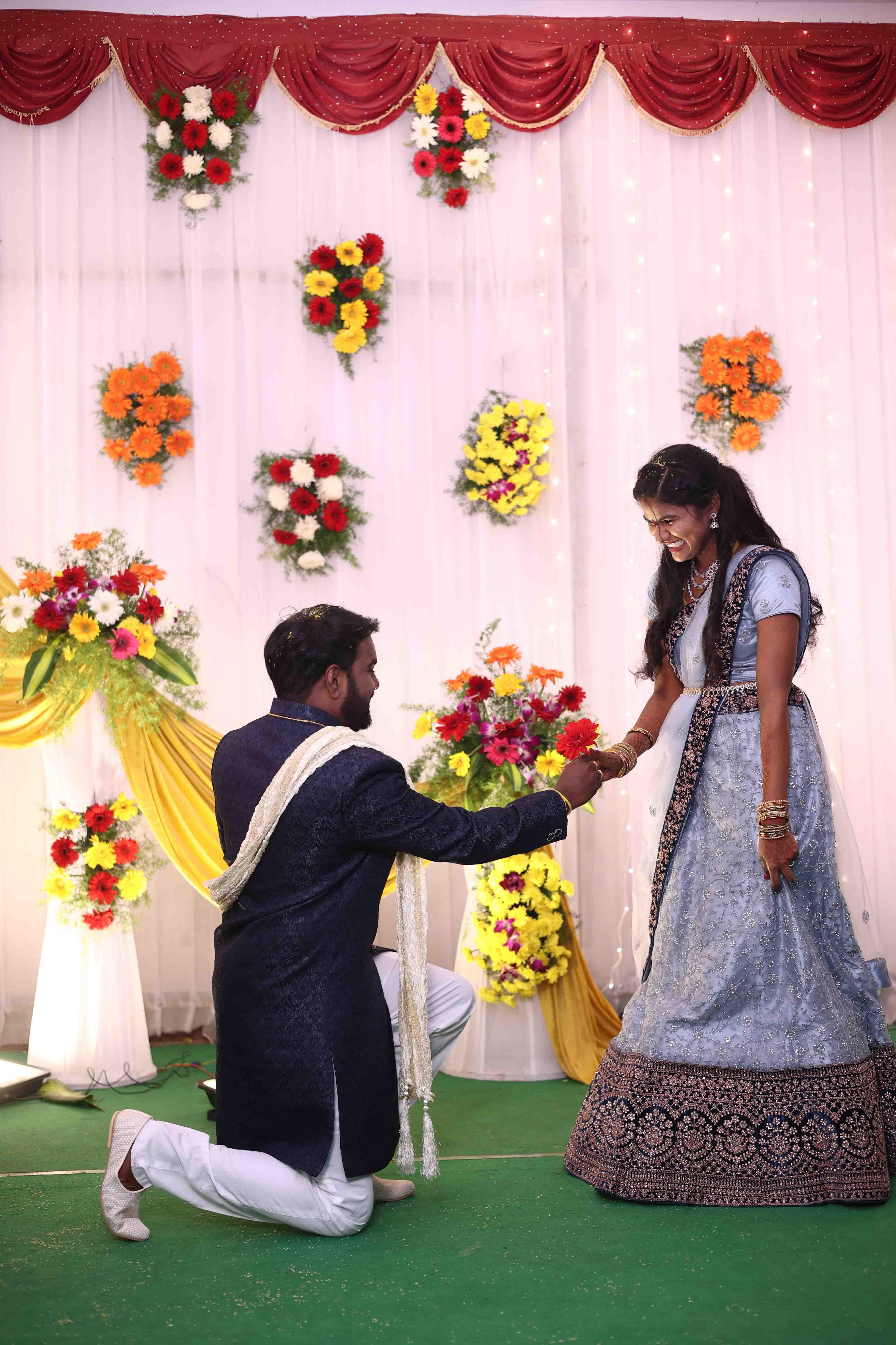A romantic proposal-style moment captured during the reception night